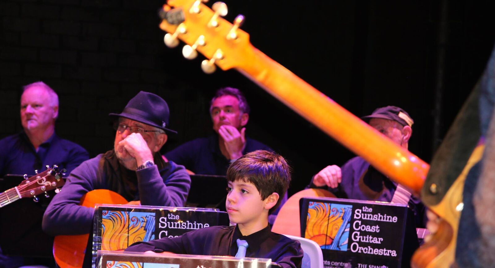 Five members of the Sunshine Coast Guitar Orchestra